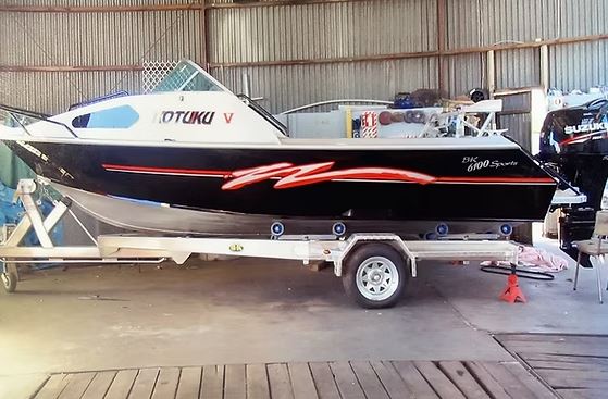 Aluminium boat on trailer
